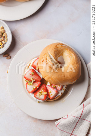 Breakfast bagels with cream cheese and strawberries. Breakfast bagels with cream cheese and strawberries. 121756222