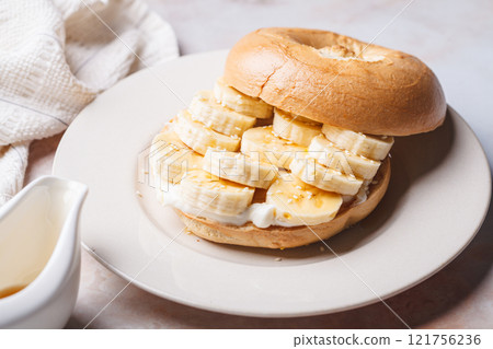 Breakfast bagels with cream cheese, banana and sesame. Breakfast bagels with cream cheese, banana and sesame. 121756236