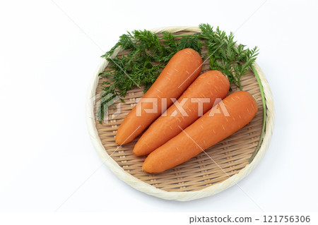 Carrot with leaves on a white background 121756306