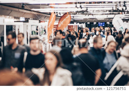 Abstract blurred people at exhibition hall of expo event trade show. Business convention show or job fair. Business concept background Abstract blurred people at exhibition hall of expo event trade show. Business convention show or job fair. Business concept background 121756751