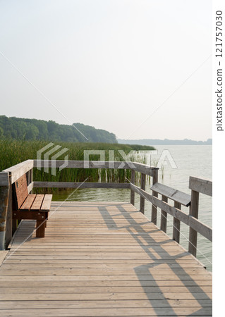 Tranquil Wooden Pier at Rice Lake State Park Overlooking Serene Waters 121757030