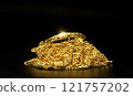 Group of gold jewelry - bracelet, necklace against black background 121757202