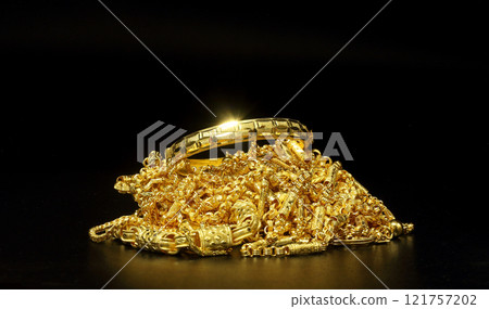 Group of gold jewelry - bracelet, necklace against black background Group of gold jewelry - bracelet, necklace against black background 121757202