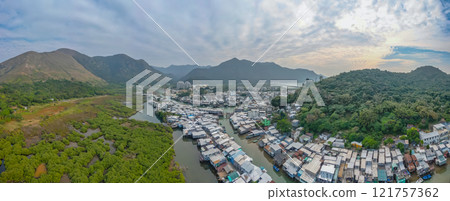 Traditional Fishing Village with Boats Along River, Tai O Dec 31 2024 121757362