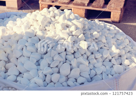 Piles of dolomite stones. White brick piles on a building project, ready for construction and decoration. 121757423