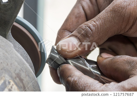 The milling cutting tool regrind process by manual operation. 121757687