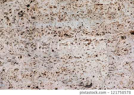 Light limestone slab with shell marks. Shell rock texture. Natural stone background Light limestone slab with shell marks. Shell rock texture. Natural stone background 121758578