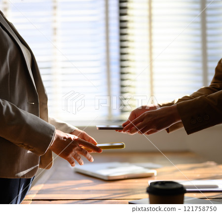 A scene where something is exchanged digitally 121758750