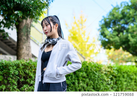 Cool woman walking in a residential area outdoors Training Diet Exercise Trimming Cool woman walking in a residential area outdoors Training Diet Exercise Trimming 121759088