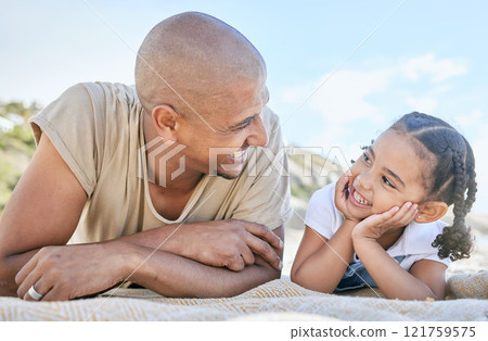 Smiling single father and little daughter looking at each other while relaxing on a beach. Adorable girl bonding with her dad and enjoying vacation. Man and child having fun and enjoying family time 121759575