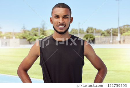 Portrait of a fit active young athlete standing alone before going for a run on a track field. Latino male looking confident and smiling outside getting ready to do his daily routine exercise outside Portrait of a fit active young athlete standing alone before going for a run on a track field. Latino male looking confident and smiling outside getting ready to do his daily routine exercise outside 121759593