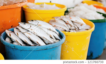 Fresh fish piled in colorful buckets at a local market showcasing vibrant seafood display, AI Generative 121760730