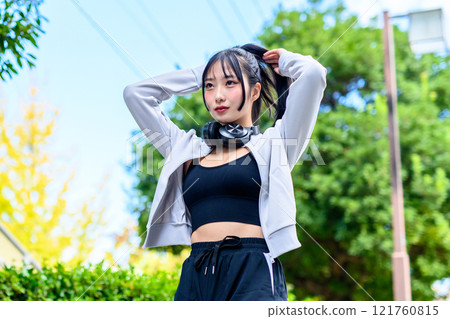 Cool woman walking in a residential area outdoors Training Diet Exercise Trimming 121760815