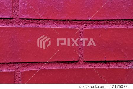 brick wall of a house painted red brick wall of a house painted red 121760823