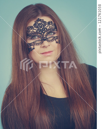 Mysterious woman wearing lace mask Mysterious woman wearing lace mask 121761038