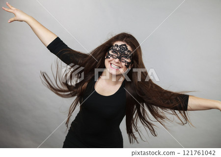 Mysterious woman wearing lace mask 121761042