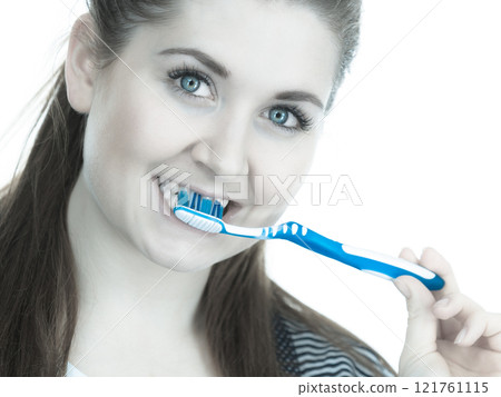 Woman brushing cleaning teeth. 121761115