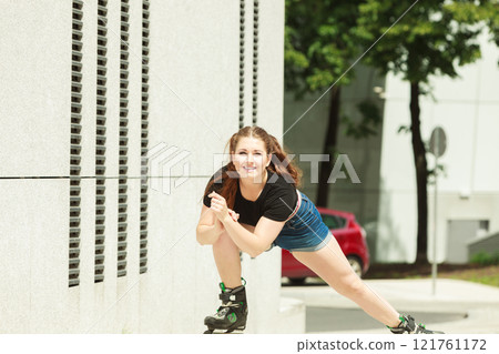 Young woman fast riding roller skates Young woman fast riding roller skates 121761172