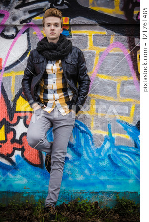 Fashion male portrait on graffiti wall Fashion male portrait on graffiti wall 121761485