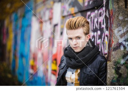 Fashion male portrait on graffiti wall 121761504