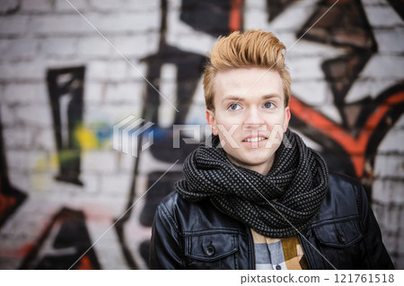 Fashion male portrait on graffiti wall Fashion male portrait on graffiti wall 121761518