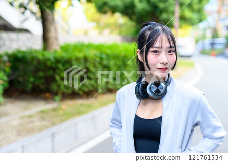A cool woman walking in a residential area outdoors Training Diet Exercise A cool woman walking in a residential area outdoors Training Diet Exercise 121761534
