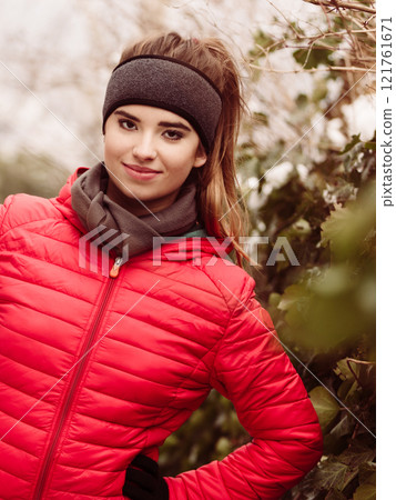 Woman wearing sportswear during winter Woman wearing sportswear during winter 121761671