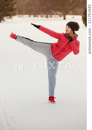 Woman wearing sportswear training boxing outside Woman wearing sportswear training boxing outside 121761685