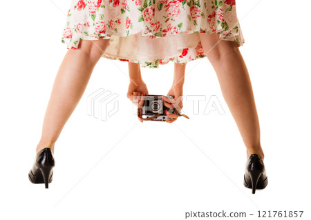 girl taking picture using vintage camera 121761857