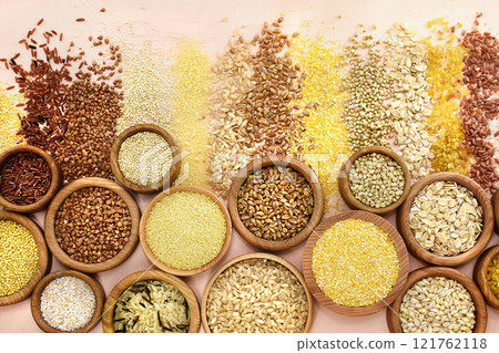 Colorful mix of grain varieties: oat and wheat, rice and millet, buckwheat and barley, quinoa and polenta. Food ingridients for healthy diet background, selective focus 121762118