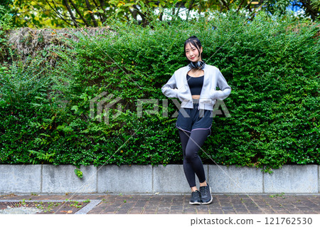 Cool woman posing outdoors, training, muscle training girl, jogging, diet, exercise, street tree Cool woman posing outdoors, training, muscle training girl, jogging, diet, exercise, street tree 121762530