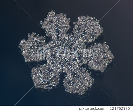 Natural snowflake crystal close-up macro photo 121762580