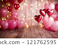 A Valentine's Day background with heart-shaped balloons in shades of pink with bokeh background and wooden floor. Valentine's day background. 121762595