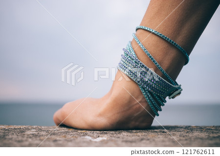 A person's hand with a bracelet on it A person's hand with a bracelet on it 121762611