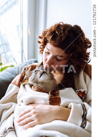 portrait young woman hugging gray fluffy domestic cat portrait young woman hugging gray fluffy domestic cat 121762716