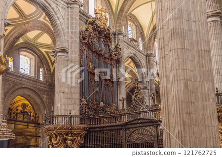 Majestic view of Mexico City Metropolitan Cathedral, a historic architectural landmark. Heritage, religion, and cultural tourism in Latin America. Symbol of history and faith in Mexico Majestic view of Mexico City Metropolitan Cathedral, a historic architectural landmark. Heritage, religion, and cultural tourism in Latin America. Symbol of history and faith in Mexico 121762725