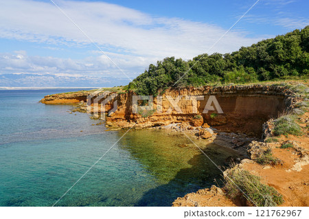 Crvenka beach, Vir, Croatia, the sand of the beach is painted with the intense red color Crvenka beach, Vir, Croatia, the sand of the beach is painted with the intense red color 121762967