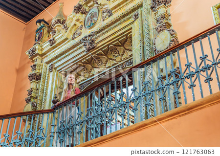 Female tourist exploring the historic Biblioteca Palafoxiana Palafoxiana Library in Puebla, Mexico. A cultural journey through history and literature in a UNESCO World Heritage site 121763063