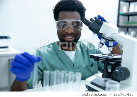Doctor scientist working in laboratory using technology and microscope to test vaccine Doctor scientist working in laboratory using technology and microscope to test vaccine 121763433