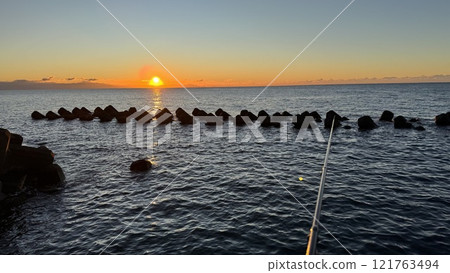 Fishing and sunrise 121763494