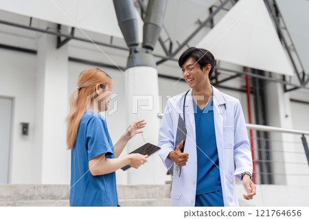 Healthcare discussion between medical students university campus candid interaction bright environment close-up view collaboration concept Healthcare discussion between medical students university campus candid interaction bright environment close-up view collaboration concept 121764656