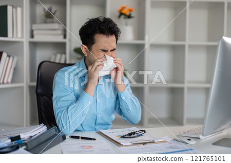 Unwell professional catches flu at work office environment emotional content close-up viewpoint on fever symptoms 121765101