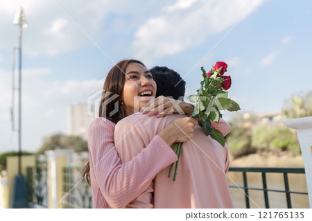 Valentine's day celebration romantic couple embracing city park photo joyful love concept Valentine's day celebration romantic couple embracing city park photo joyful love concept 121765135
