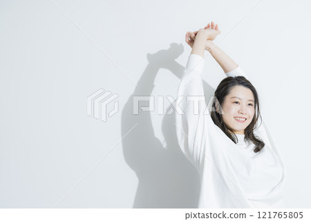 A young woman stretching A young woman stretching 121765805