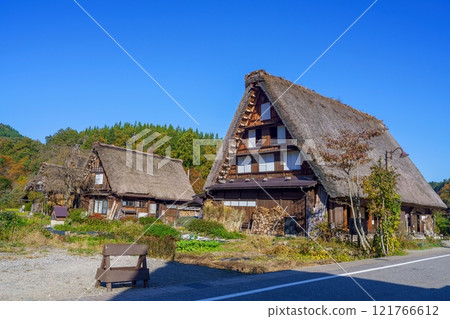 Autumn scenery of a Gassho-style village against a blue sky Autumn scenery of a Gassho-style village against a blue sky 121766612