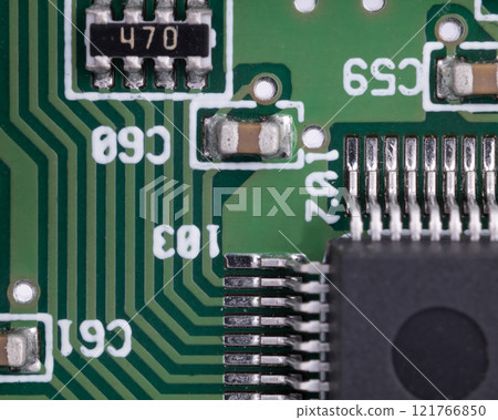 Close up of circuit board with integrated circuit and capacitors Close up of circuit board with integrated circuit and capacitors 121766850