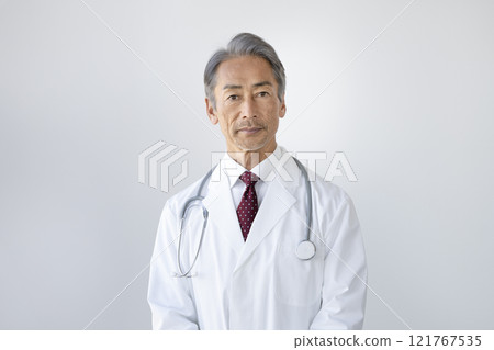 A male doctor in his 60s looking at the camera 121767535