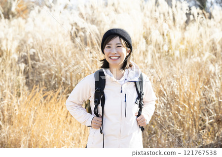 Woman enjoying hiking Woman enjoying hiking 121767538
