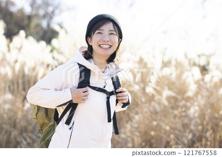 Woman enjoying hiking Woman enjoying hiking 121767558