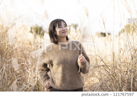 Woman enjoying a walk in nature 121767597